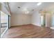 Living room with laminate flooring and access to sunroom at 204 Venice Palms Blvd, Venice, FL 34292