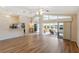 Open living room with high ceilings and view of kitchen at 204 Venice Palms Blvd, Venice, FL 34292