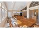 Sunroom with wooden furniture and access to backyard at 204 Venice Palms Blvd, Venice, FL 34292