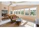 Spacious sunroom with ample natural light and seating area at 204 Venice Palms Blvd, Venice, FL 34292