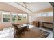 Sunroom with wicker furniture and golf course view at 204 Venice Palms Blvd, Venice, FL 34292