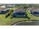 Aerial view of house with pool and lakefront location at 20710 Saluti Pl, Venice, FL 34293