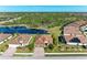 Aerial view of house with pool and lakefront location at 20710 Saluti Pl, Venice, FL 34293