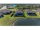 Aerial view of house with pool and lakefront location at 20710 Saluti Pl, Venice, FL 34293