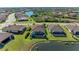 Aerial view of house with pool and lakefront location at 20710 Saluti Pl, Venice, FL 34293