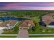 Luxury home with tile roof, pool, and lake view in a quiet community at 20710 Saluti Pl, Venice, FL 34293