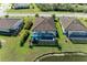 Aerial view of house with pool and lakefront location at 20710 Saluti Pl, Venice, FL 34293