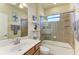 Guest bathroom with single vanity, shower/tub combo at 20710 Saluti Pl, Venice, FL 34293