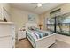 Guest bedroom with a full-size bed and window view at 20710 Saluti Pl, Venice, FL 34293
