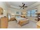 Bedroom with a wooden bed frame, dresser and mirror at 20710 Saluti Pl, Venice, FL 34293
