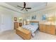 Main bedroom with king-size bed and ensuite bathroom access at 20710 Saluti Pl, Venice, FL 34293