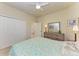 Bright bedroom with a comfortable bed and built-in closet at 20710 Saluti Pl, Venice, FL 34293
