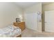 Charming bedroom with a twin bed, dresser, and ample closet space at 20710 Saluti Pl, Venice, FL 34293