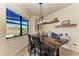 Casual dining area with farmhouse table and window views at 20710 Saluti Pl, Venice, FL 34293