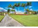 Community entrance sign for Gran Paradiso, with lush landscaping and palm trees at 20710 Saluti Pl, Venice, FL 34293