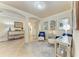 Spacious entry with tile floors, decorative console table, and mirrors at 20710 Saluti Pl, Venice, FL 34293