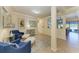 Spacious entryway with seating area, tile floors, and views to the living area at 20710 Saluti Pl, Venice, FL 34293
