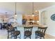Island kitchen with granite countertops and breakfast bar seating at 20710 Saluti Pl, Venice, FL 34293