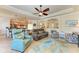 Open living room featuring leather furniture and kitchen views at 20710 Saluti Pl, Venice, FL 34293