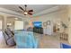 Spacious living room with comfy seating and a large TV at 20710 Saluti Pl, Venice, FL 34293