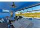 Relaxing screened-in patio with pool, spa, and lake view at 20710 Saluti Pl, Venice, FL 34293