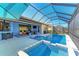 Luxury pool and spa with screened enclosure and lake view at 20710 Saluti Pl, Venice, FL 34293