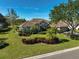 Single story house with a well-maintained lawn and landscaping at 2173 Muskogee Trl, Nokomis, FL 34275