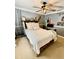 Bedroom with a queen-size bed, ceiling fan, and a desk at 2704 Barret Ave, Plant City, FL 33566