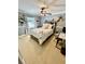Well-lit bedroom with a queen-size bed, ceiling fan, and a desk at 2704 Barret Ave, Plant City, FL 33566