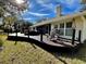 Large deck with seating area and hot tub at 2704 Barret Ave, Plant City, FL 33566