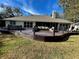 Large deck with hot tub and seating area at 2704 Barret Ave, Plant City, FL 33566