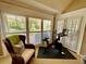Room with Peloton bike and seating area, featuring large windows and access to outside at 2704 Barret Ave, Plant City, FL 33566