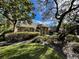 One-story home with mature trees and landscaping at 2704 Barret Ave, Plant City, FL 33566