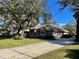 Home with a brick facade, driveway and landscaping at 2704 Barret Ave, Plant City, FL 33566