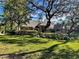 House with a manicured lawn and large oak trees at 2704 Barret Ave, Plant City, FL 33566