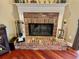 Brick fireplace with a white mantel in a living room at 2704 Barret Ave, Plant City, FL 33566