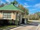 Community gated entrance with guardhouse, ensuring security and privacy at 2704 Barret Ave, Plant City, FL 33566