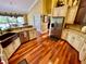 Large kitchen featuring a copper farm sink, granite counters, and hardwood floors at 2704 Barret Ave, Plant City, FL 33566