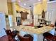 Spacious kitchen boasts granite counters, ample cabinetry, and hardwood floors at 2704 Barret Ave, Plant City, FL 33566