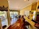 Bright kitchen with hardwood floors, an island, and a view of the backyard at 2704 Barret Ave, Plant City, FL 33566