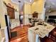 Open concept kitchen with granite island, stainless steel appliances, and hardwood floors at 2704 Barret Ave, Plant City, FL 33566