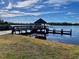 Wooden dock with gazebo overlooking lake at 2704 Barret Ave, Plant City, FL 33566