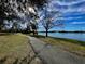 Paved walkway meanders along the lake, offering scenic views and a peaceful atmosphere at 2704 Barret Ave, Plant City, FL 33566