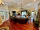 Large living room with hardwood floors, fireplace, and a comfortable sectional sofa at 2704 Barret Ave, Plant City, FL 33566