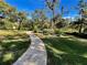 Curving stone pathway through lush landscaping at 2704 Barret Ave, Plant City, FL 33566