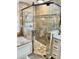 Large walk-in shower with multi-texture tile and glass enclosure at 2704 Barret Ave, Plant City, FL 33566