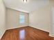 Simple bedroom with hardwood floors and a window at 2824 47Th E St, Palmetto, FL 34221