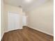 Well-lit bedroom with wood-look floors and double door closet at 2824 47Th E St, Palmetto, FL 34221