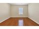 Well-lit bedroom with hardwood floors and window at 2824 47Th E St, Palmetto, FL 34221