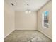 Simple dining room with tile flooring and a chandelier at 2824 47Th E St, Palmetto, FL 34221